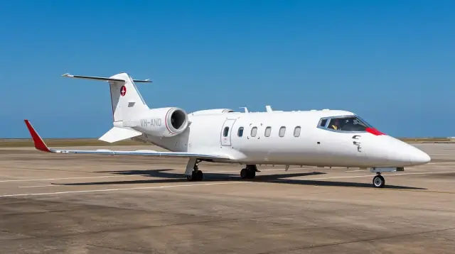 Red Dot Air Ambulance Bombardier Learjet 60SE VH-AND on the tarmac at Seletar Airport Singapore
