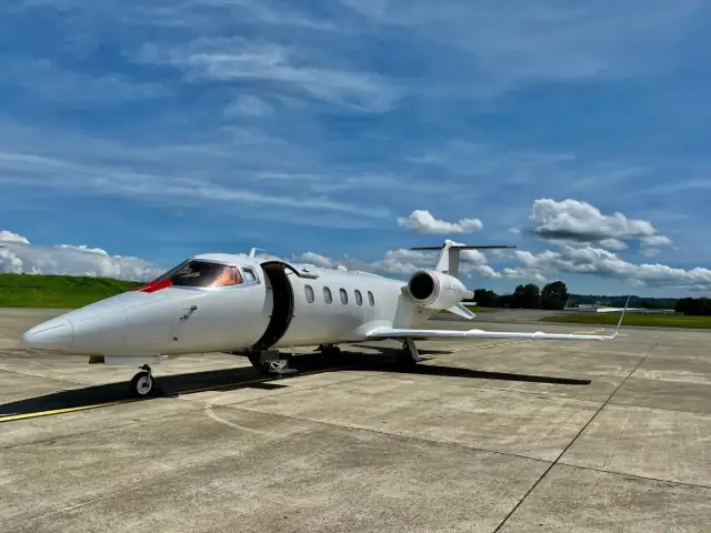 Red Dot Air Ambulance Bombardier Learjet 60XR VH-RDI on the tarmac at Seletar Airport Singapore